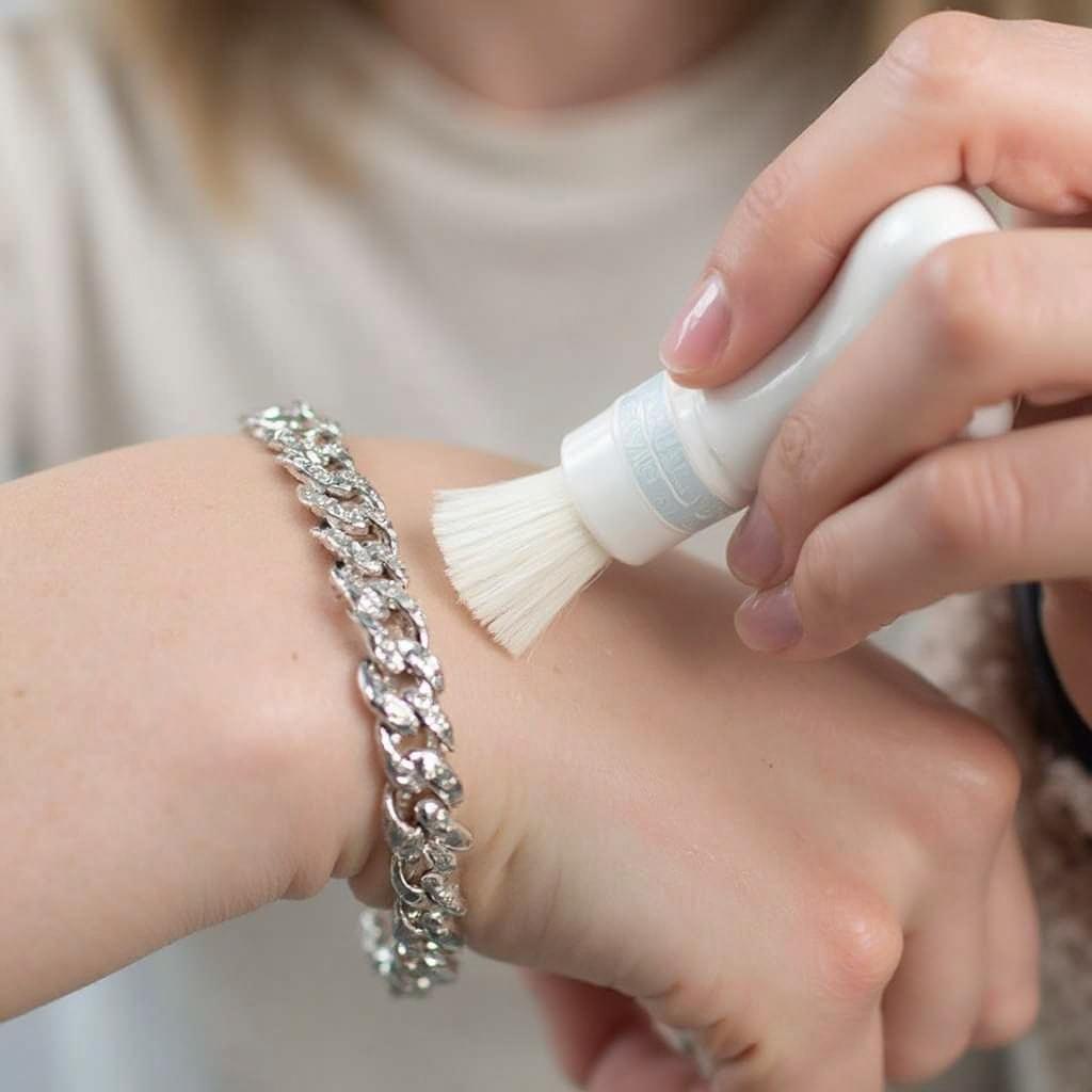 Cleaning a silver bracelet with a specialized solution