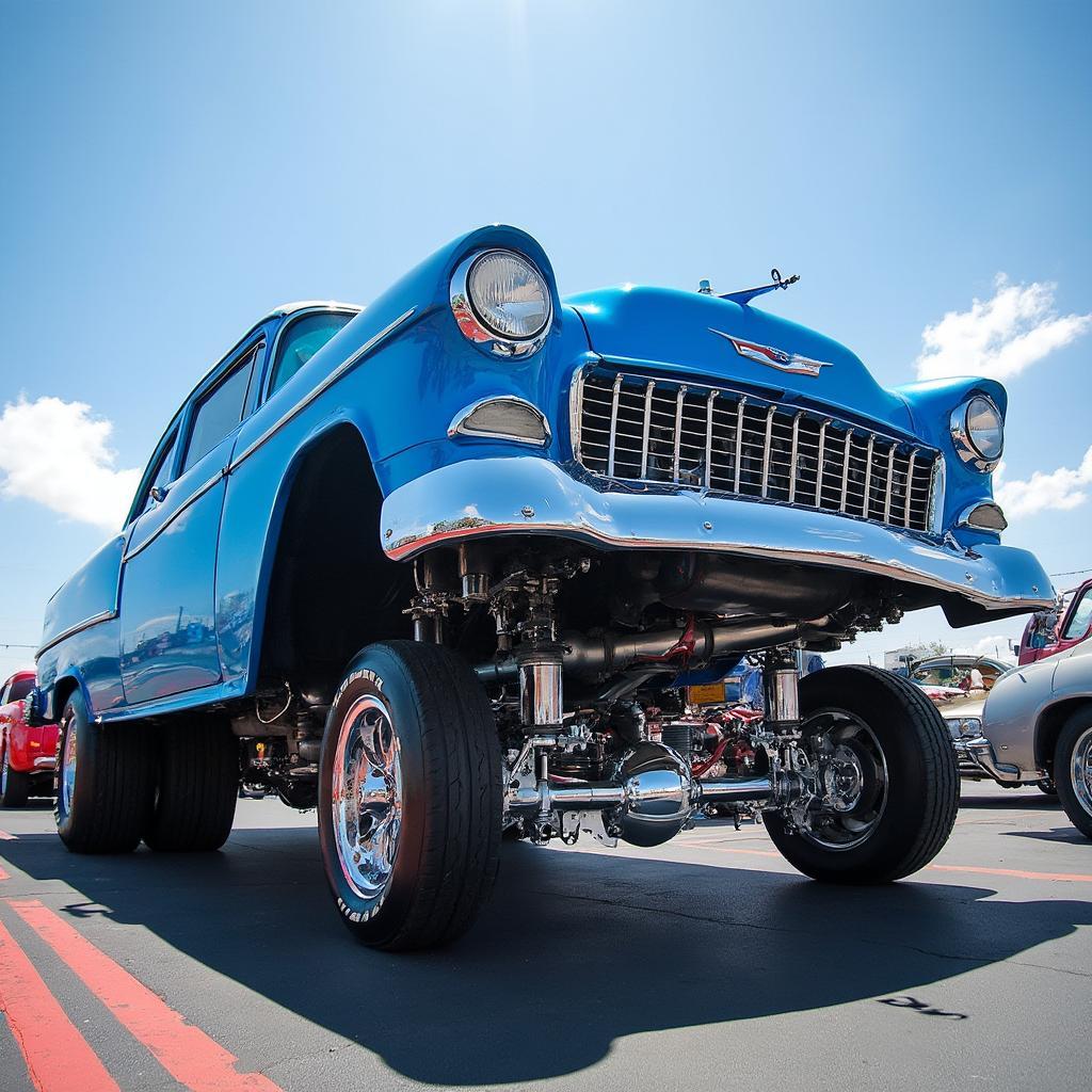 Lowrider car show ground level shot showcasing hydraulics