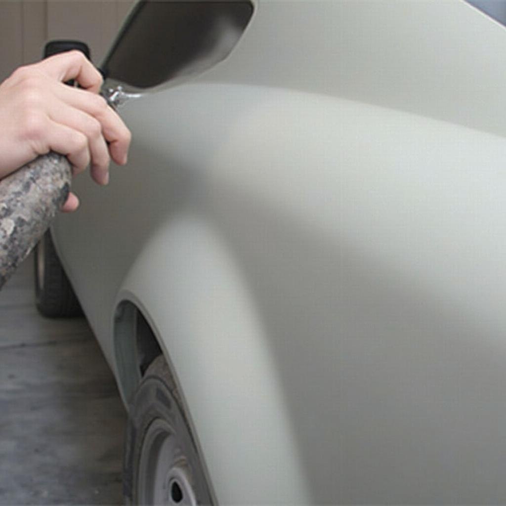 Applying Spray Paint on Car