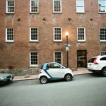 Smart car parked inefficiently on a city street